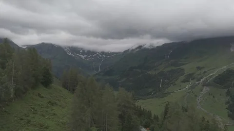 Stunning Austrian Mountains with Forest and Clouds Stock Footage 280307190
