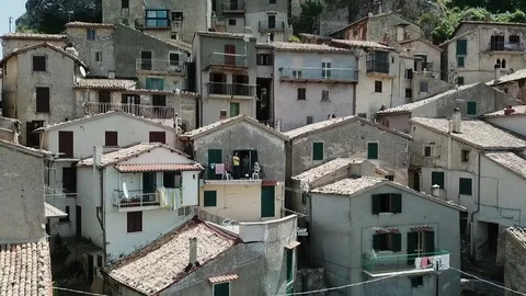 Stunning backflight - Cervara, an Ancient medieval village perched on rock spur Stock Footage 92468028