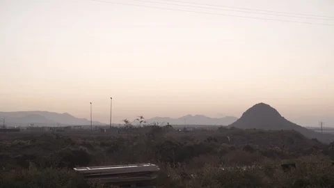 Stunning Background With Grass, Lampposts And Mountains In Spain Stock Footage 129443996
