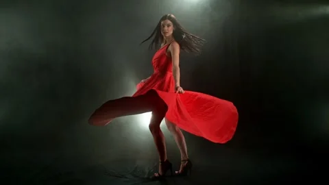 Stunning Black-Haired Woman in Ruby Red Dress and High Heels Stock Footage 306857332
