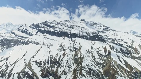Stunning bottom view on snowy towering Mount Gangapurna, terrific peak, Nepal Stock Footage 124686042