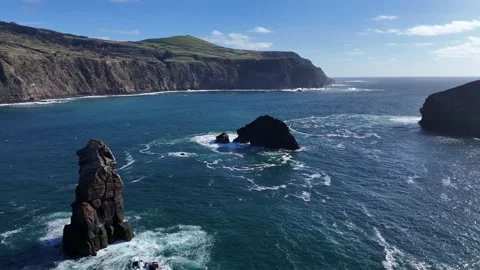 Stunning cinematic drone shot of basalt sea stacks off the coast of Mosteir.. Stock Footage 337522620