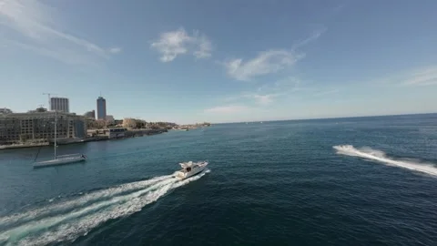 Stunning cinematic dynamic shot chasing yacht and boat in the sea with fpv drone Stock Footage 243351832