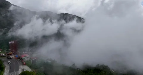 A stunning cinematic scene capturing a mountain range enveloped in vibrant Stock Footage 282961680