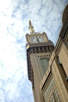 Stunning clock tower shining under bright sky Stock Photos