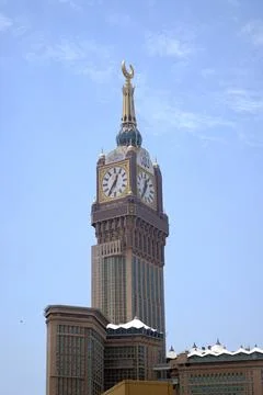 Stunning clock tower shining under bright sky Stock Photos