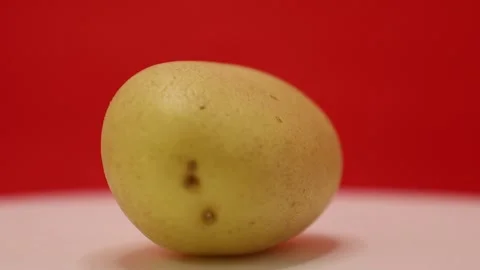 Stunning close up of a potato showcasing its texture and color Stock Footage 328635215