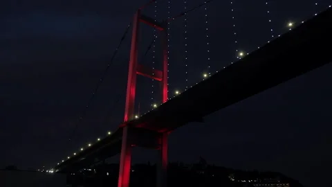 Stunning close up of red illuminated cable-stayed bridge. Night sky Video stock 258944419