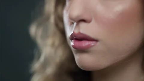 A Stunning Close-up of a Womans Face Showcasing Flawless Makeup and Glossy Lips Stock Footage 314337711
