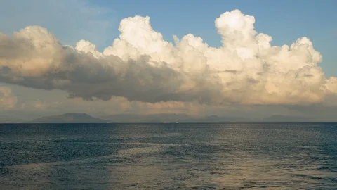 Stunning clouds over the smooth surface of the Mediterranean sea. 4K 動画素材 124584845