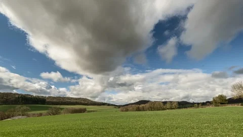 Stunning clouds time lapse over sweeping landscape Stock Footage 236329818