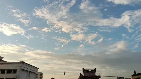 Stunning Clouds Timelapse | Dramatic Sky &amp; Weather Transition Over Rooftops Stock Footage 340286305