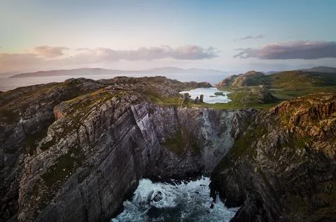 Stunning Coastal Landscape Featuring Dramatic Cliffs and Powerful Ocean Waves Stock Photos