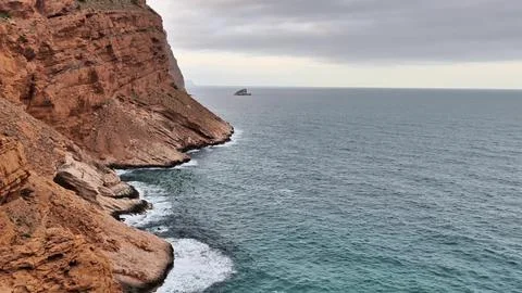 A Stunning Coastal Landscape Featuring Dramatic Rocky Cliffs and an Expansive Stock Photos