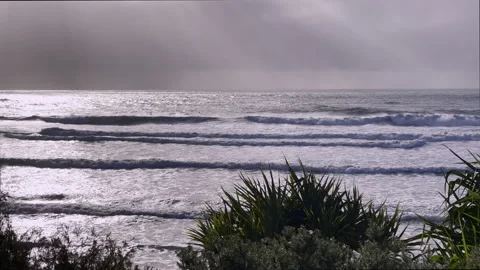 Stunning coastal surf scene - elevated view, early morning - overcast, backlit Stock Footage 242324506