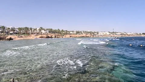 Stunning Coastal Views at Sunset Showcasing the Pristine Waters and Rocky Shores Video stock 330101339