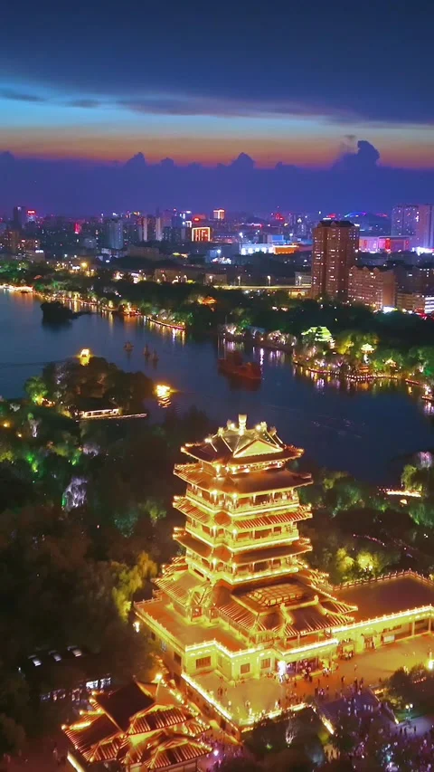 Stunning Daming Lake Night View with Illuminated Chaoran Tower in Jinan Stock Footage 331121380