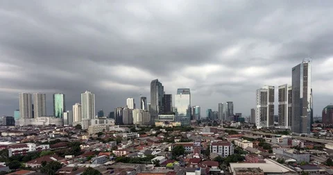 Stunning day to night time lapse of Jakarta skyline on a stormy evenying Stock Footage 82561942