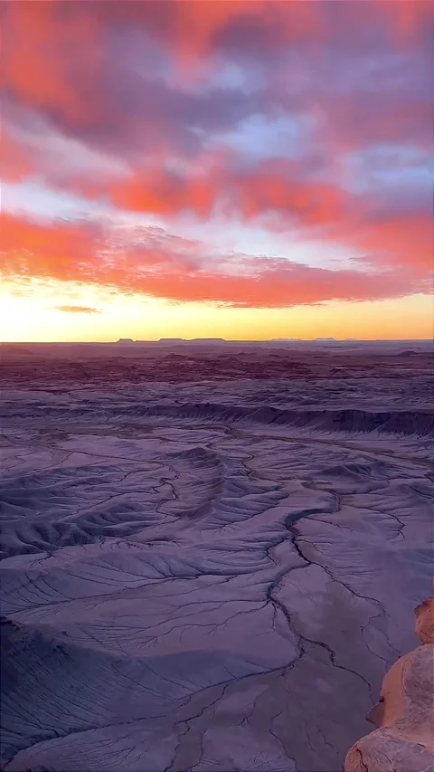 Stunning Desert Landscape Under Dramatic Sunset Skies Stock Footage 323299416