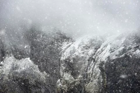 Stunning dramatic landscape image of snowcapped Glyders mountain range in Sno Stock Photos