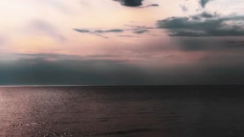 Stunning Dramatic Sea Sunset with Warm Rays Reflecting on the Water Stock Footage 312015686