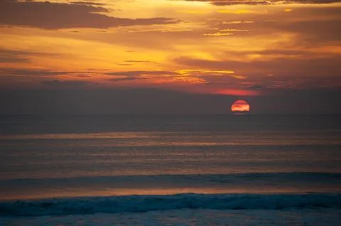 Stunning dramatic sunset over the ocean. Stock Photos
