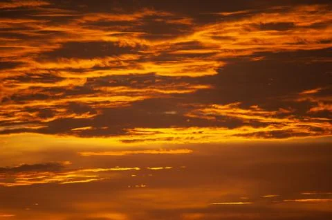 Stunning dramatic sunset over the ocean. Stock Photos