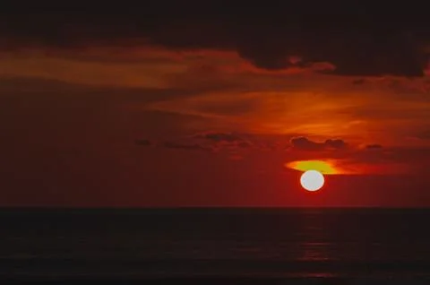 Stunning dramatic sunset over the ocean. Stock Photos