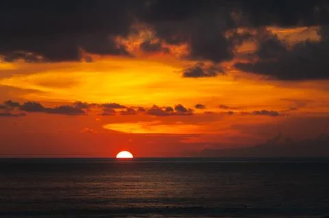 Stunning dramatic sunset over the ocean. Stock Photos