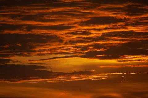 Stunning dramatic sunset over the ocean. Stock Photos