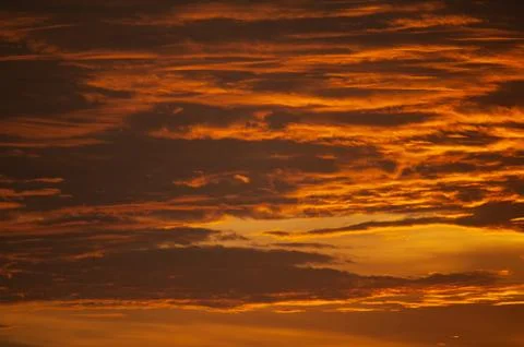 Stunning dramatic sunset over the ocean. Stock Photos