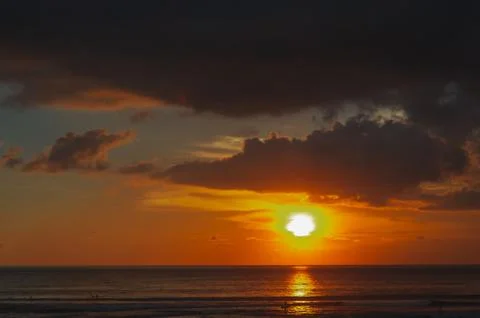 Stunning dramatic sunset over the ocean. Stock Photos