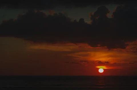 Stunning dramatic sunset over the ocean. Stock Photos