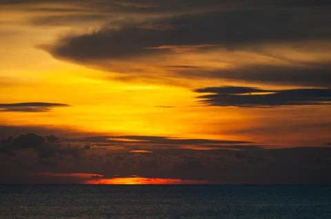 Stunning dramatic sunset over the ocean. Stock Photos