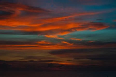 Stunning dramatic sunset over the ocean. Stock Photos