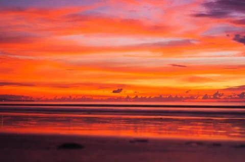 Stunning dramatic sunset over the ocean. Stock Photos