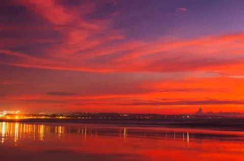 Stunning dramatic sunset over the ocean. Stock Photos