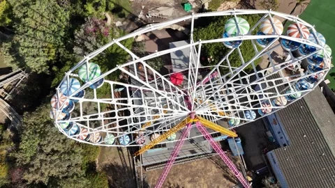 A stunning drone shot of a Ferris wheel in an amusement park Stock Footage 294261752