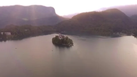 Stunning drone Shot Of Island Lake Bled Transition Through Phone Stock Footage