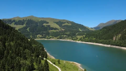 Stunning Drone View of a Clear Alpine Lake and Lush Mountains in the Austri.. Stock Footage 337042464