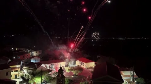 Stunning drone view of intense colorful fireworks exploding directly over a Stock Footage 333889104