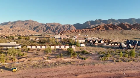 Stunning drone view of Issyk-Kul Lake at sunset, showcasing golden skies Stock Footage 328943208
