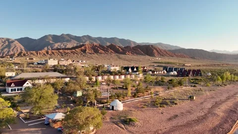 Stunning drone view of Issyk-Kul Lake at sunset, showcasing golden skies Stock Footage 328943657