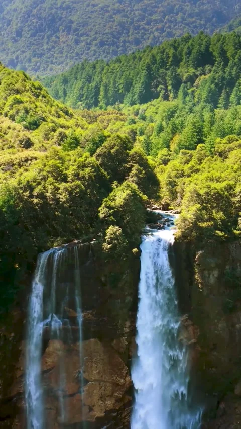 Stunning Drone View of Massive Waterfall Plunging into River (Nature Power) 스톡 동영상 321664400