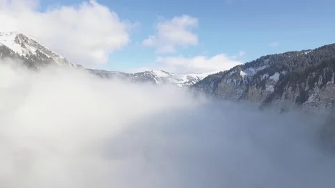 Stunning Drone views over Snowy trees, a frozen lake mountains in French Alps. Stock Footage 71294860