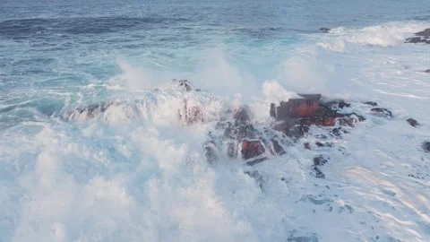 Stunning Dynamic Ocean Waves Powerfully Crashing on Rocky Shore Along the Stock Footage 311582034