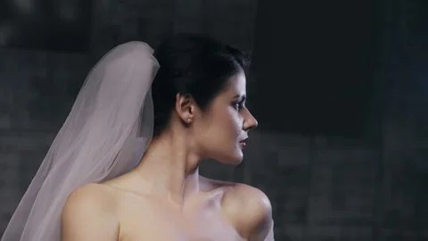 Stunning elegant bride portrait captured in a profile view, highlighting her  Stock Footage 344703334