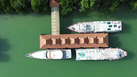 Stunning Elevated Glimpse of Idyllic Waterfront Featuring Boats Anchored Stock Footage 325187715