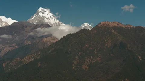 Stunning evening views of Annapurna range majestic mountains and village Stock Footage 303694472