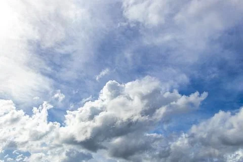 Stunning featherlike clouds drifting through radiant tropical blue skyline .. Stock Photos